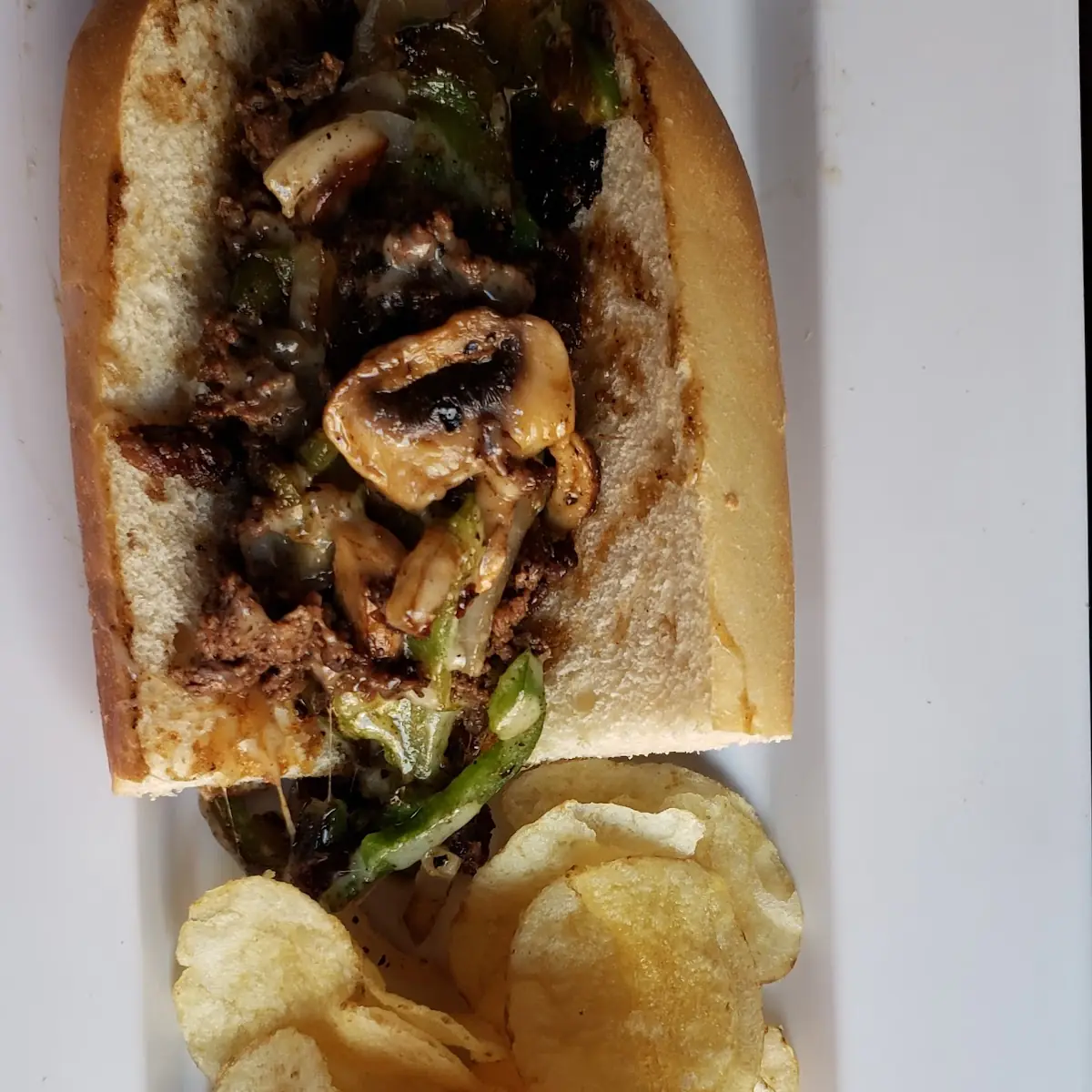 Cheese Steak Sandwich and Chips