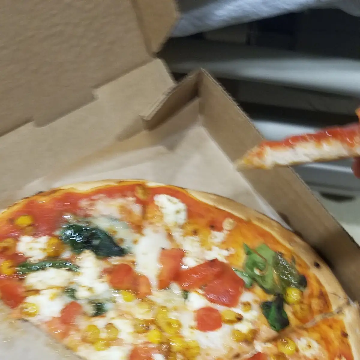 Pizza with Mozzarella & Goat Cheese Tomatoes Corn Spinach