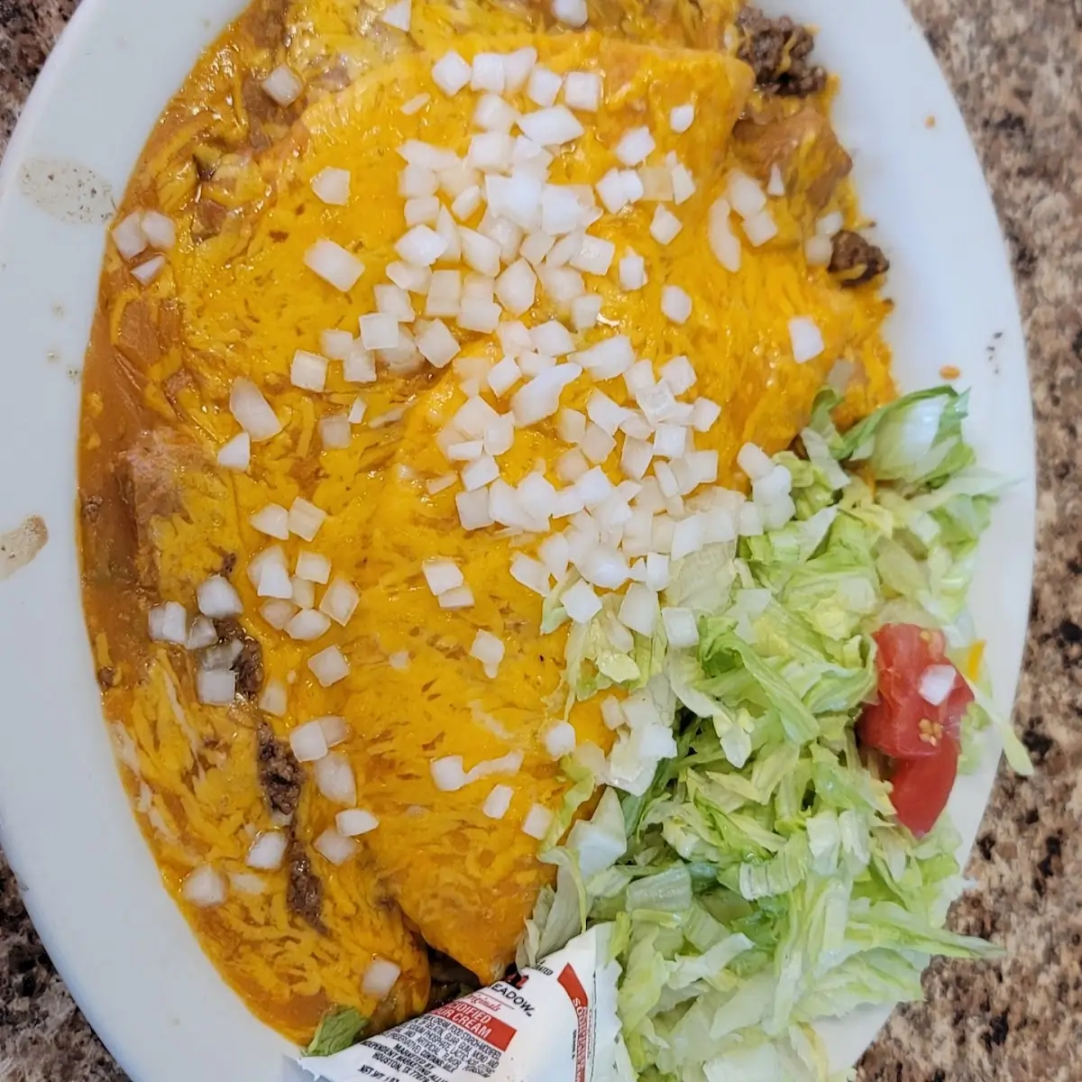 Sodt Shell Ground Beef Taco Smothered with Cheese and Onion