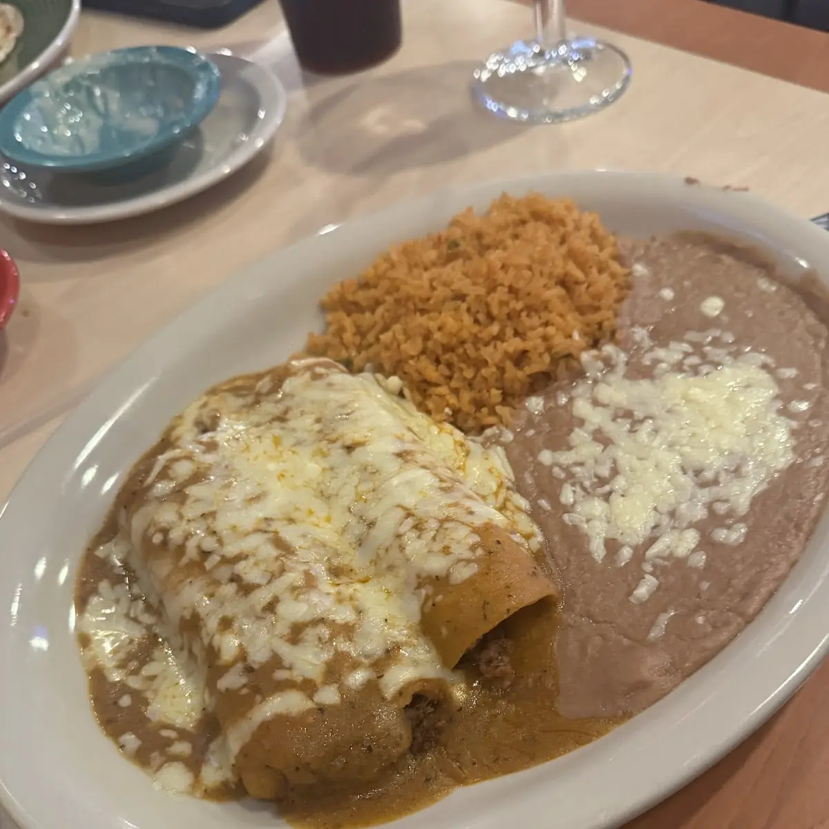 Enchiladas with Refried Beans and Rice