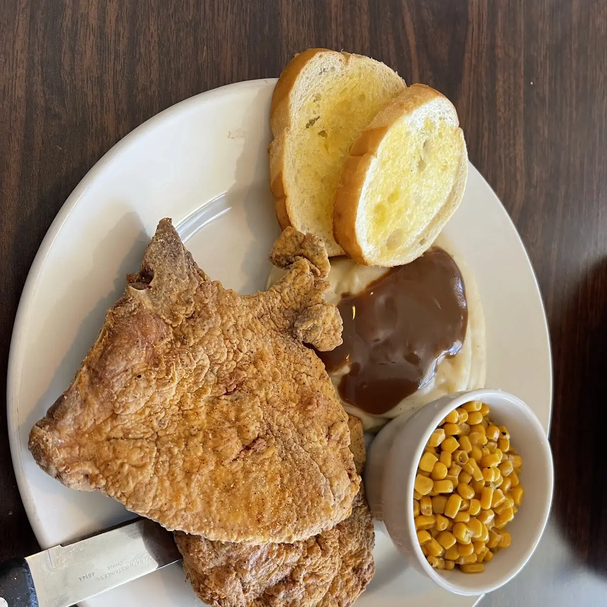 Fried Pork Chops Mashed Potatoes and Gravy with Corn