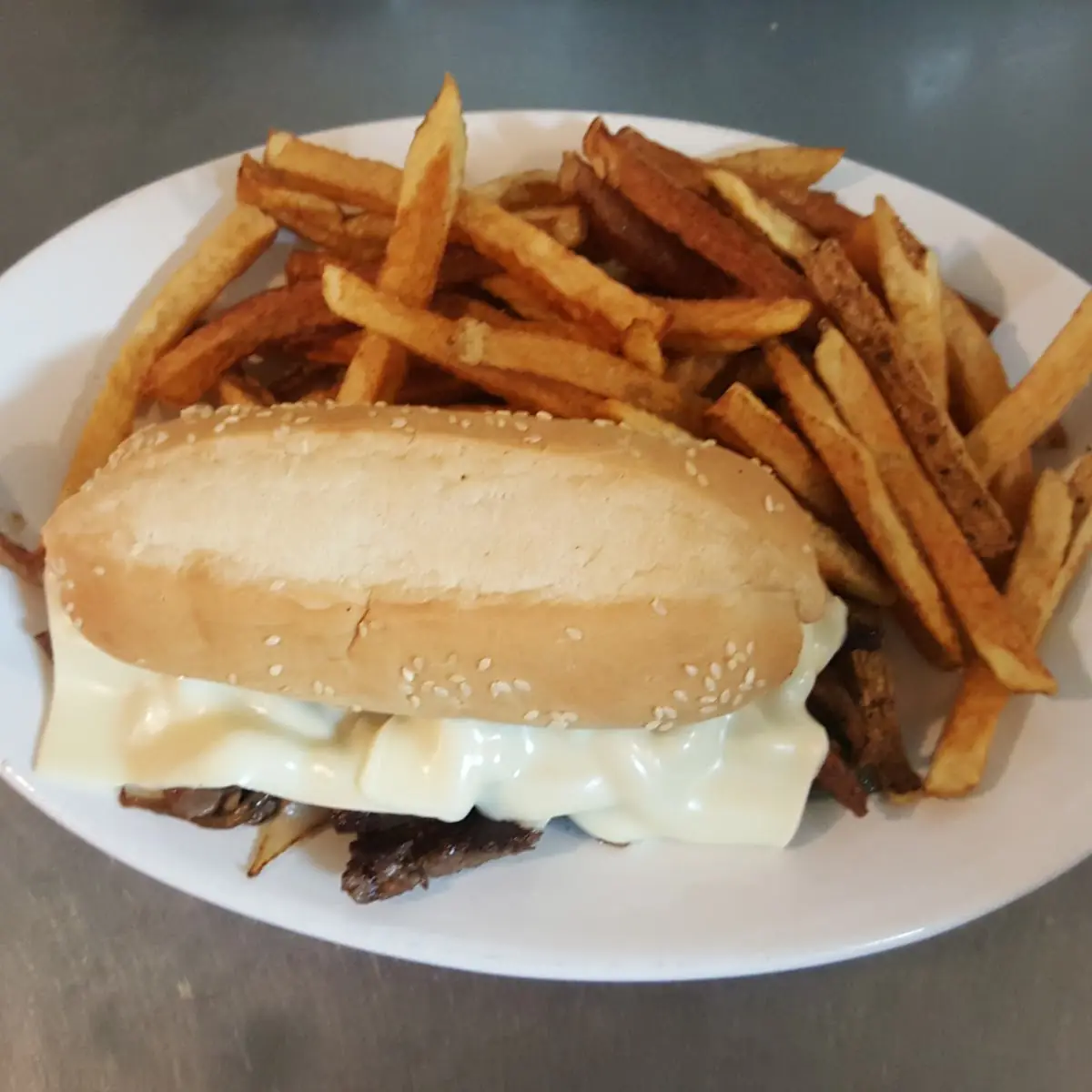 Philly Cheese Steak Sandwich and Fries