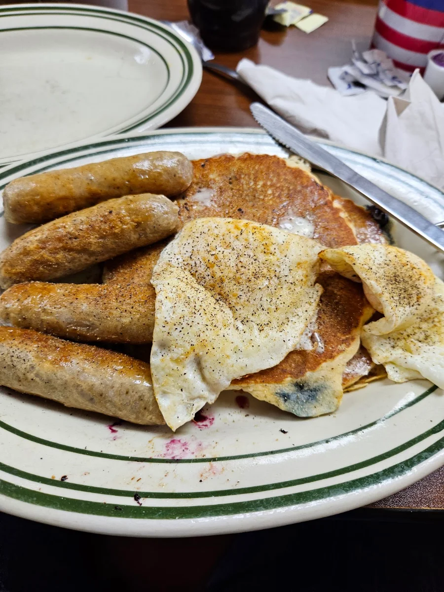 Blueberry Pancakes and Link Sausage with Eggs over Medium