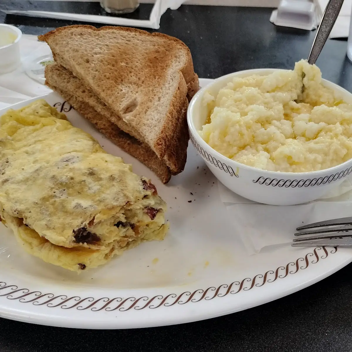 Bec Omelette Grits Hash Browns Wheat Toast