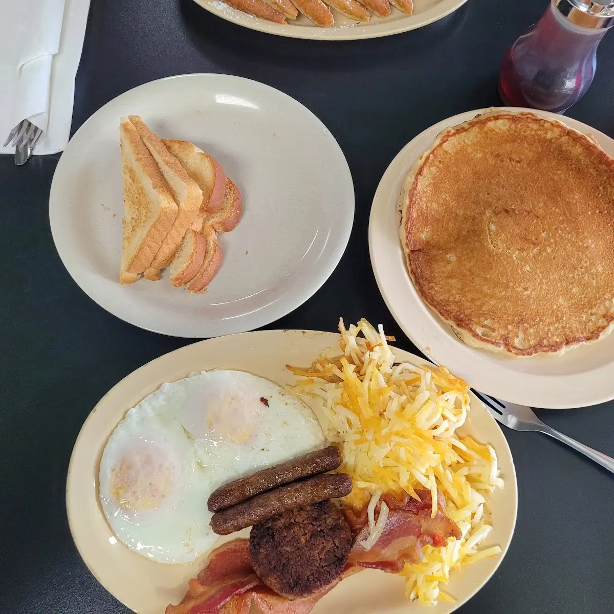 Two Pancake Breakfast with Eggs Bacon Fried Potatoes