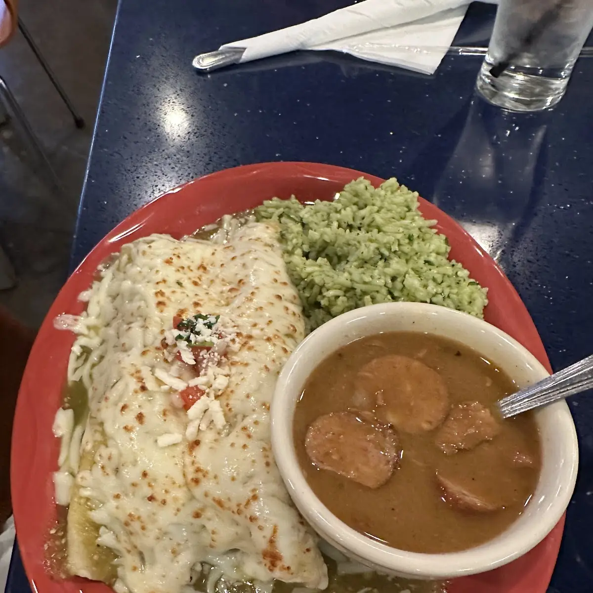 Melted Cheese Green Enchiladas with Rice and Beans