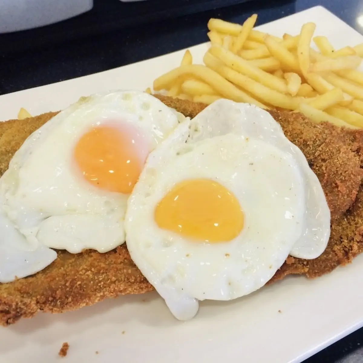 Milanesa a Caballo with 2 Fried Eggs on Top