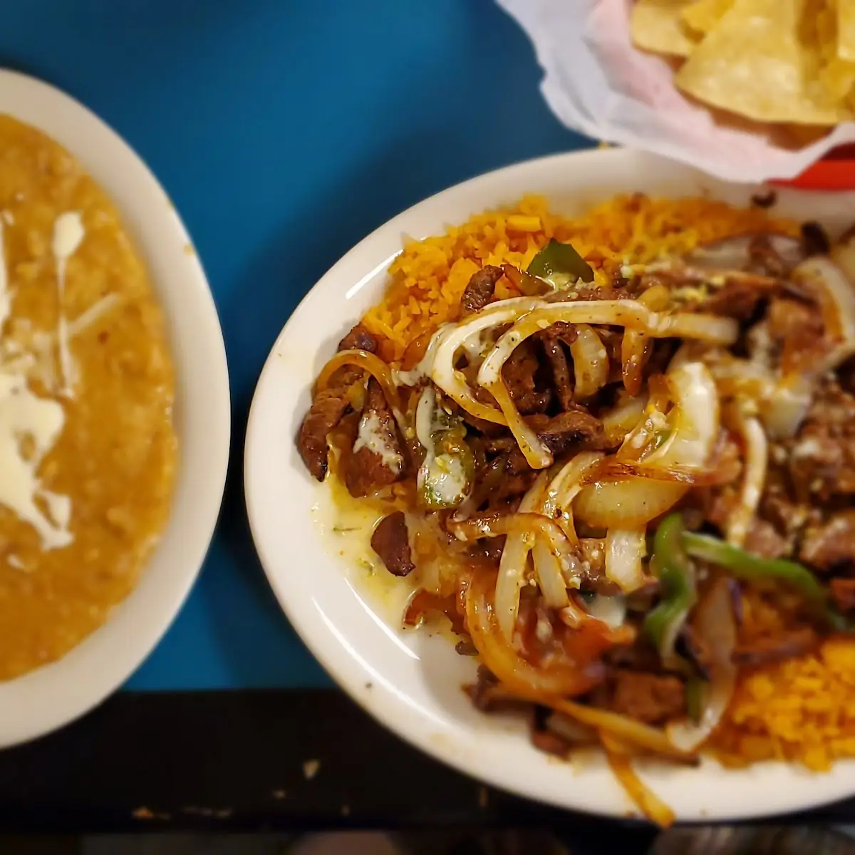 Rice Deluxe with Steak with Refried Beans