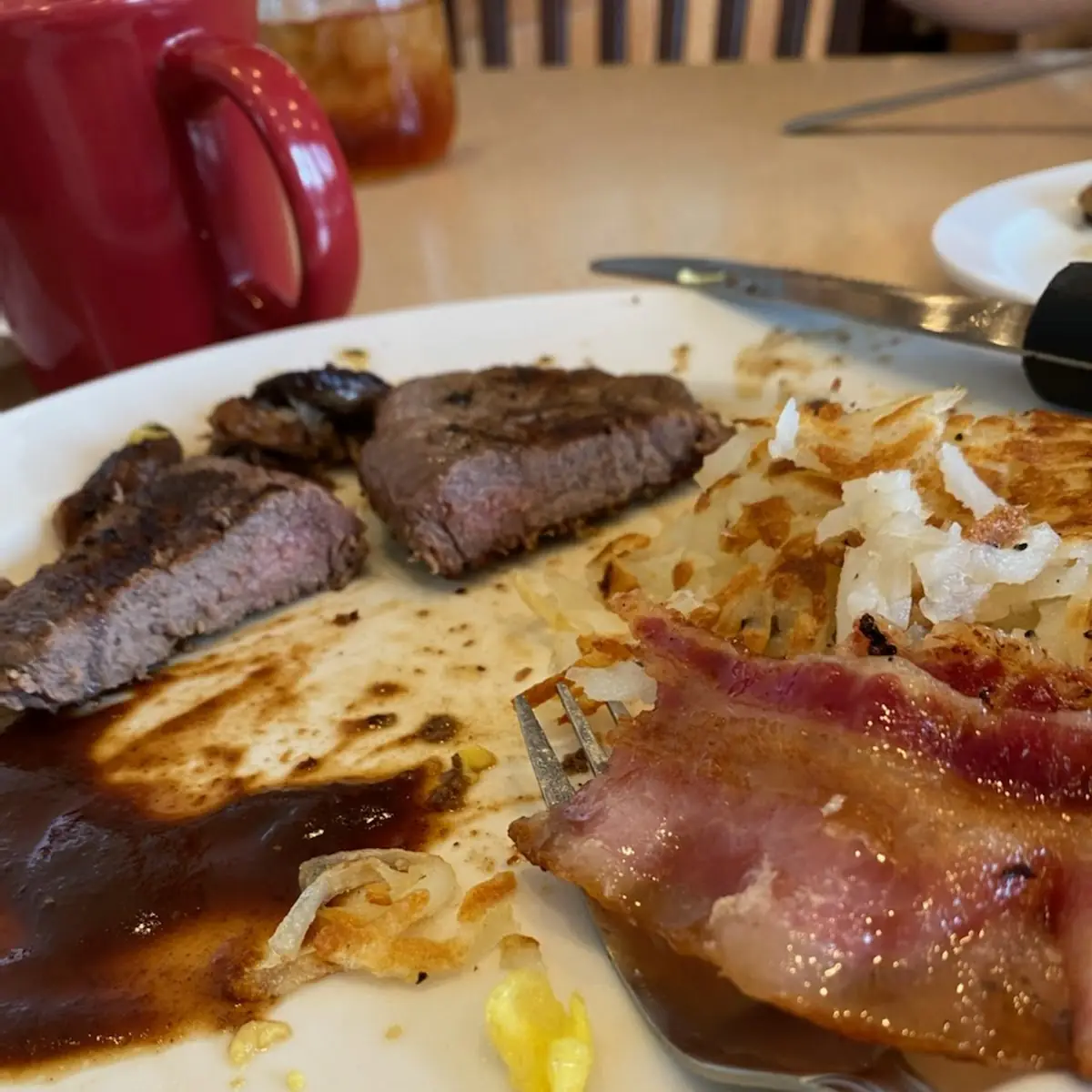 Medium Rare Bacon and a so Called Medium Cooked Steak with Extra Grease on the Side
