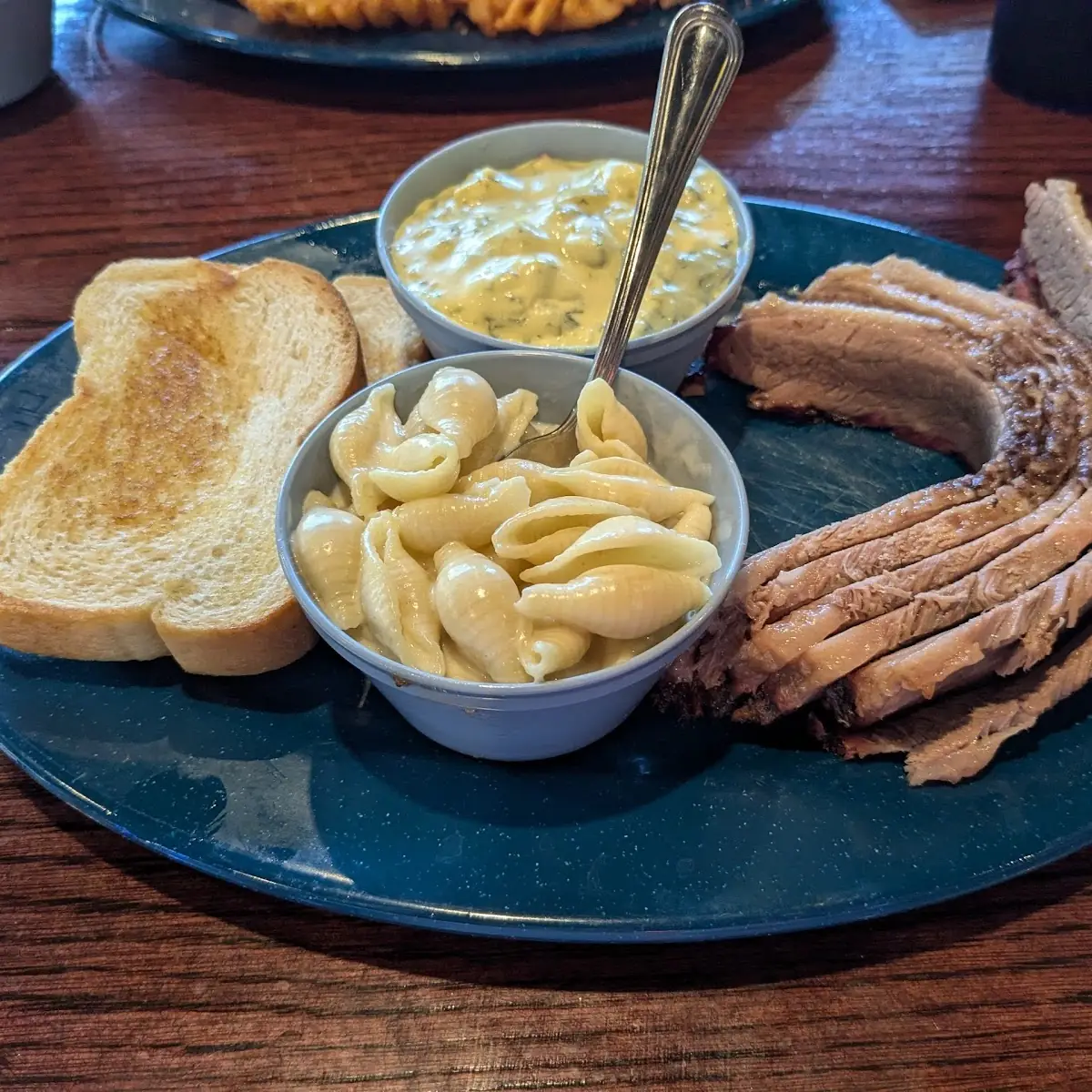 Sliced Brisket Potato Salad and Mac and Cheese