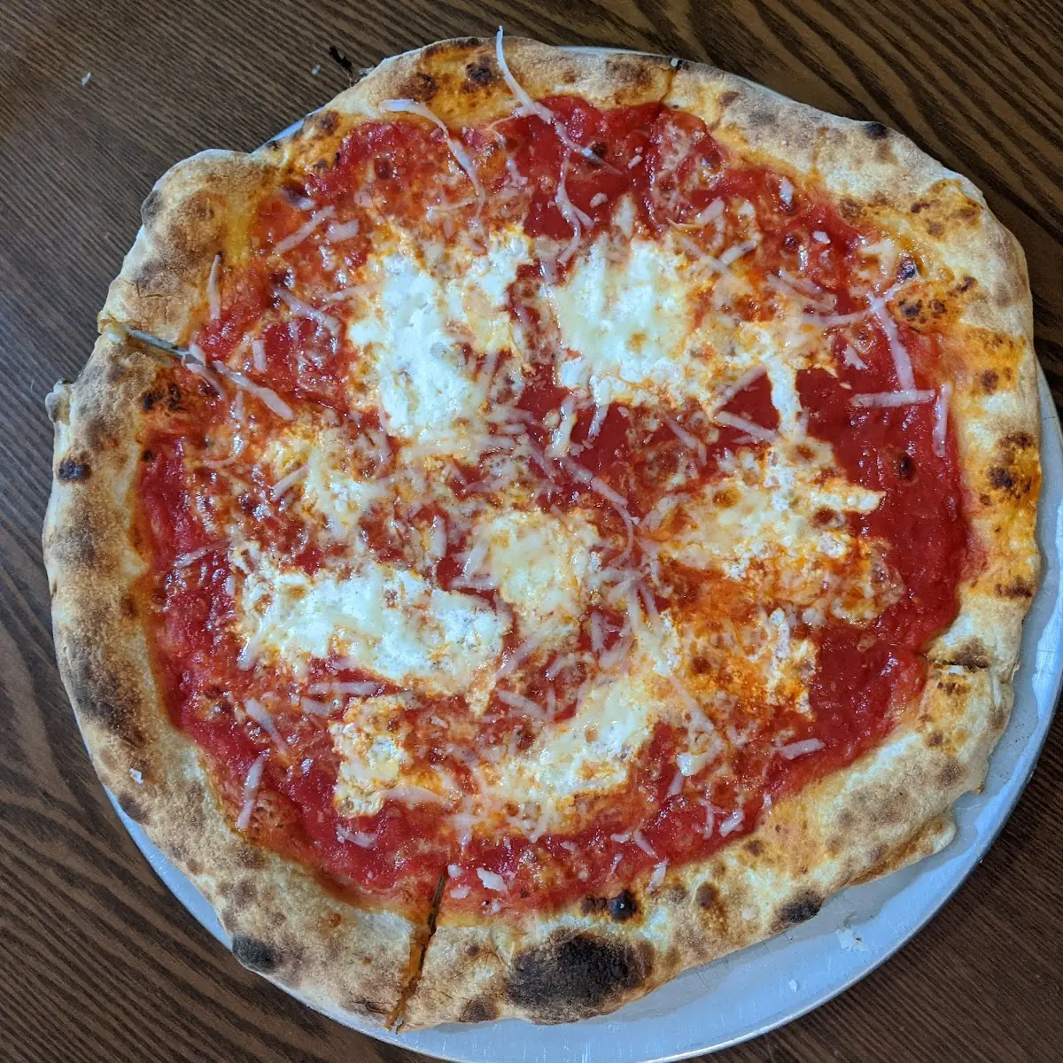 Sliced Cheese Pizza with Fresh Basil