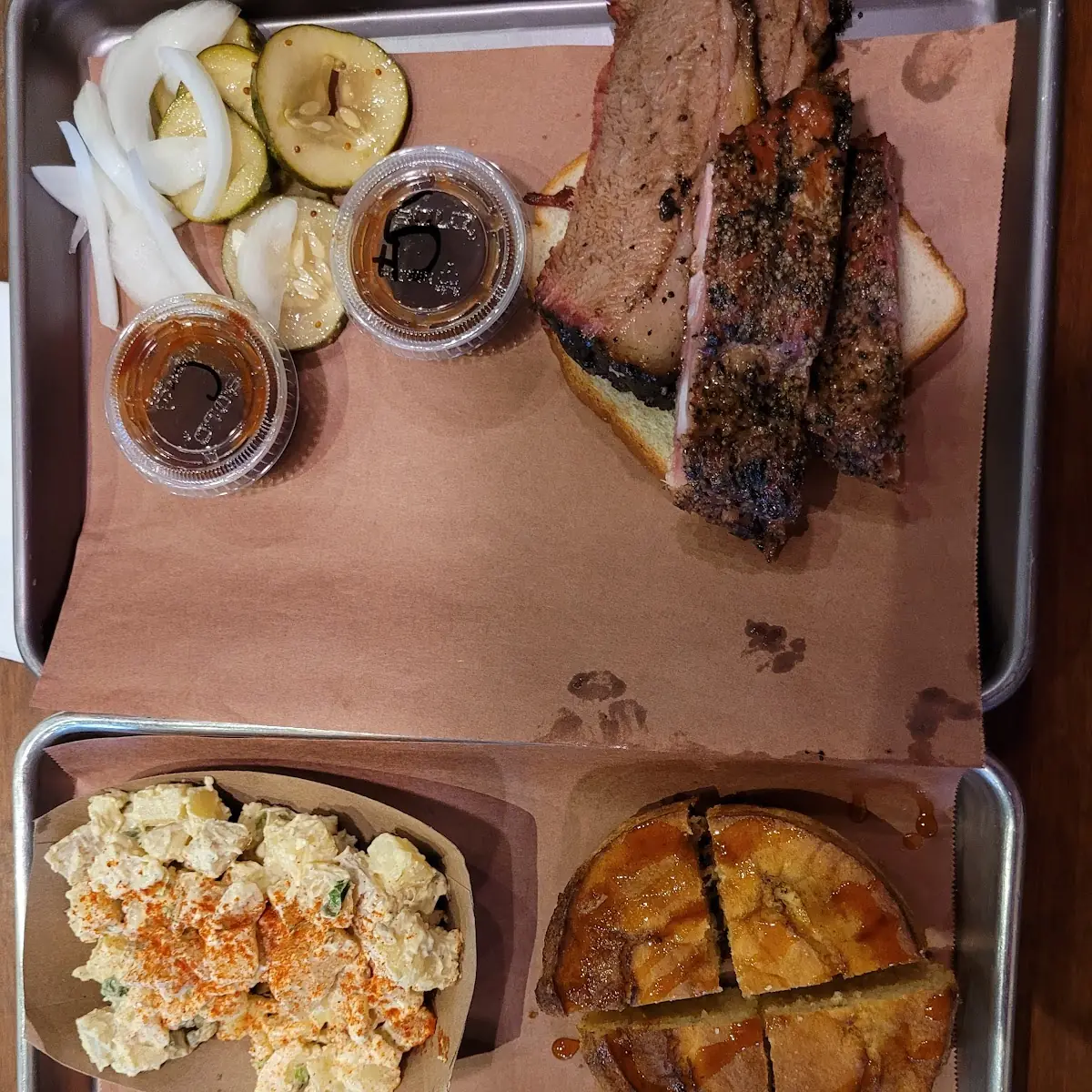 Sampler Platter Brisket Ribs Potato Salad and Cornbread