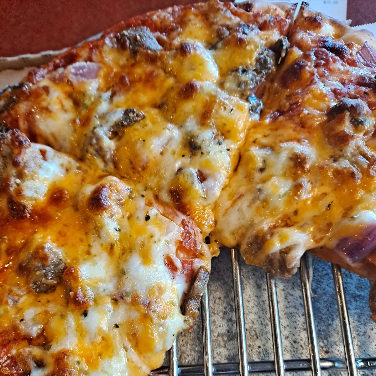 Solo Pizza with Pepperoni Hamburger Onions Fresh Mushrooms and Cheddar Cheese
