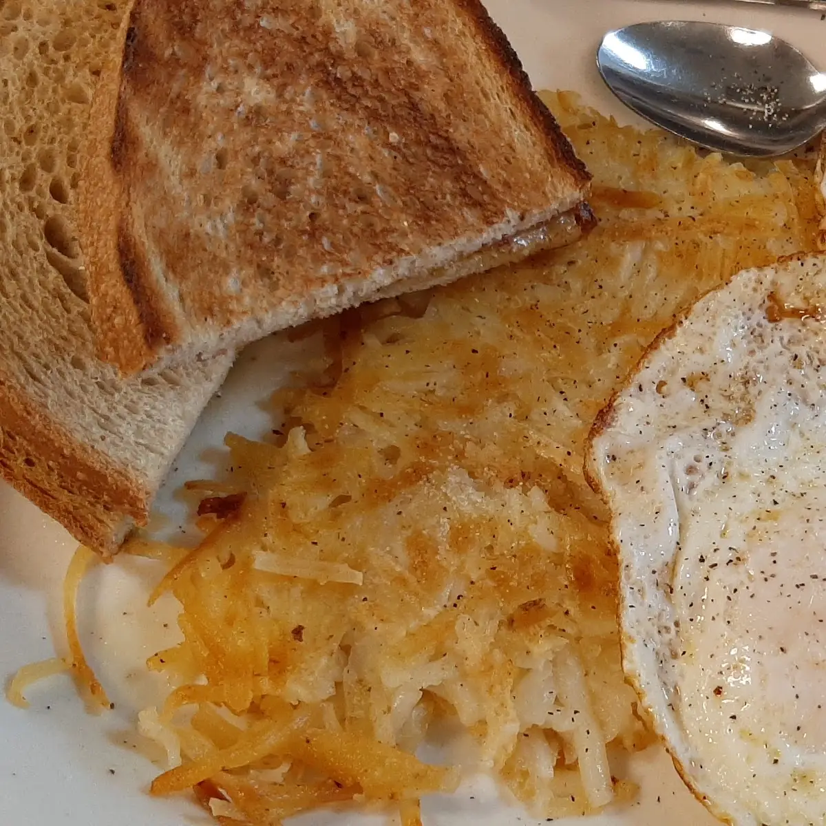 Two Eggs over Easy Rye Toast and Home Fries