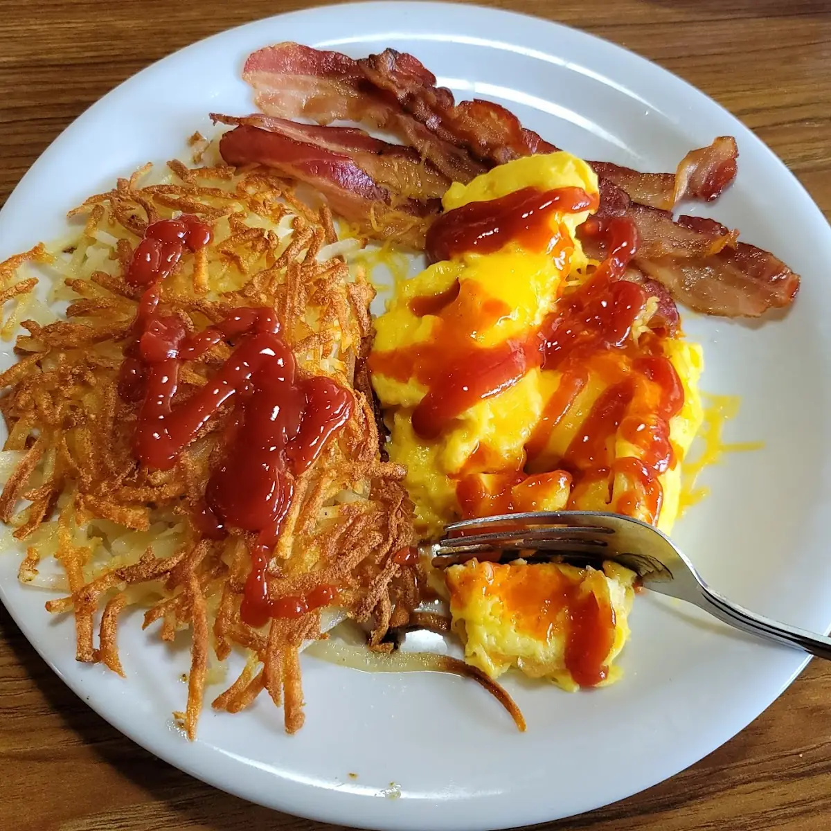 Scrambled Eggs Hash Browns and Bacon Strips