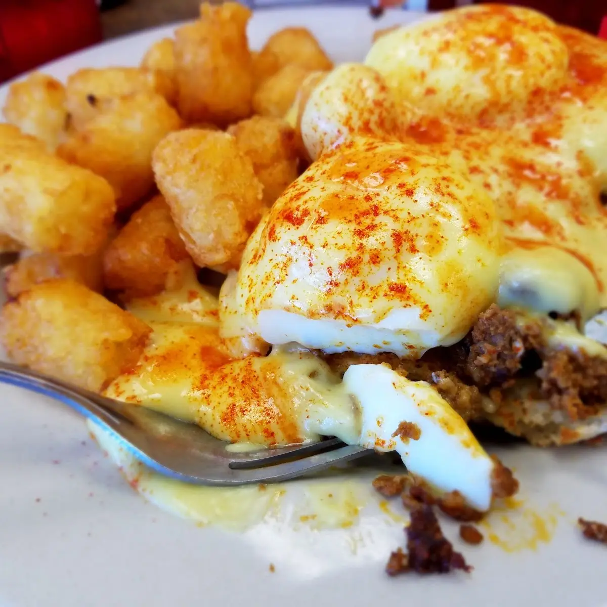 Chorizo Eggs Benedict with Tater Tots