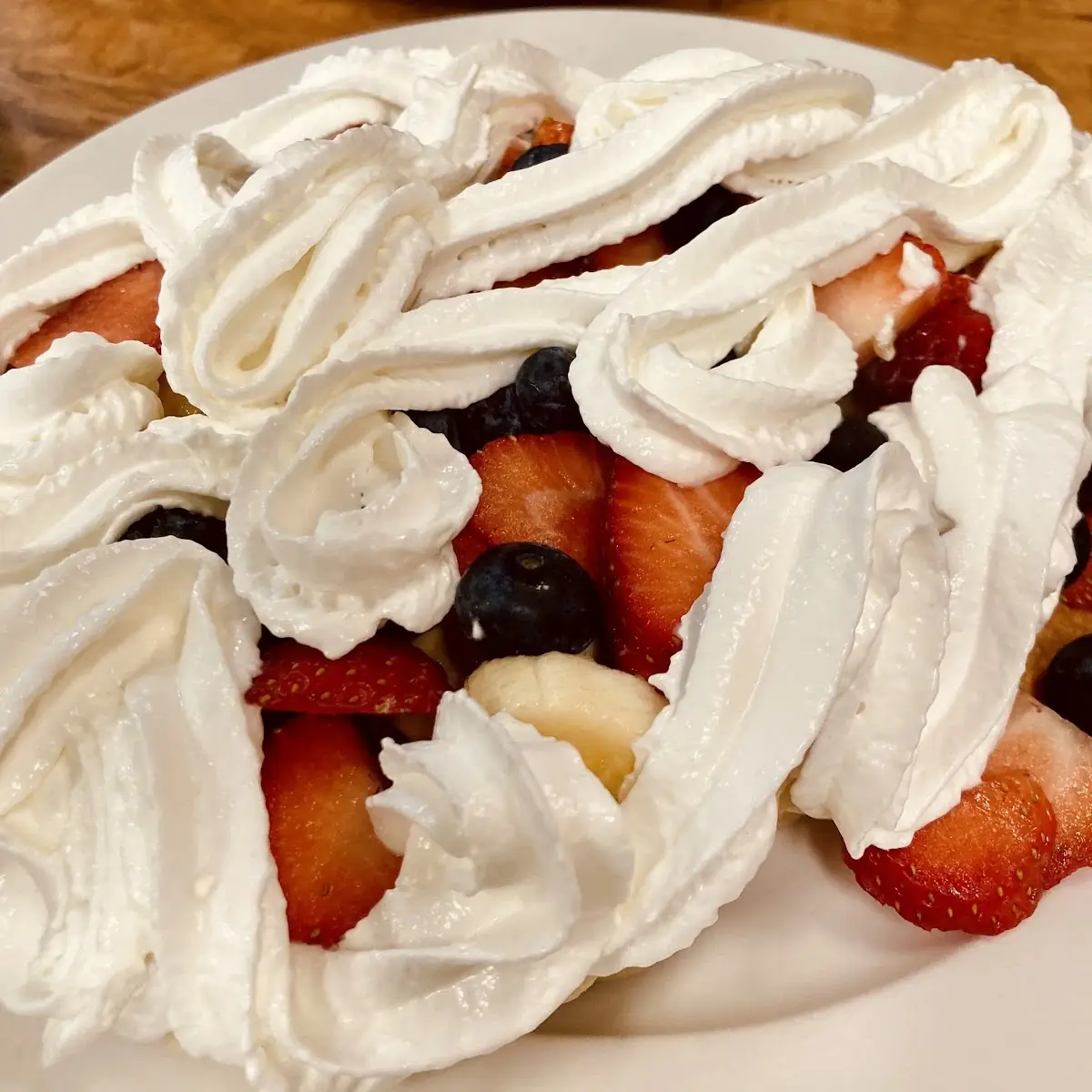 Topped with Fresh Fruit and Whipped Cream