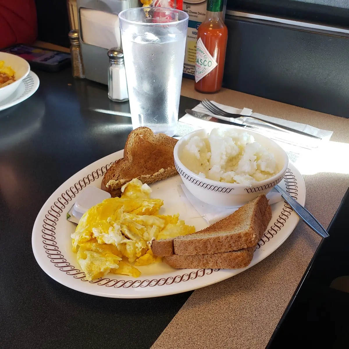 Scrambled Eggs Grits and Whole Wheat Toast