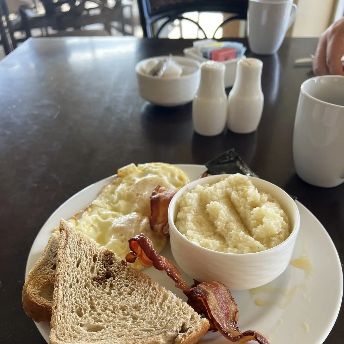 Two Eggs Bacon Grits and Toast