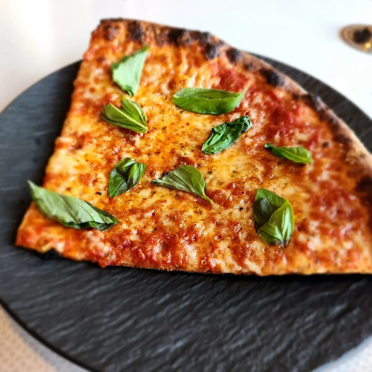 Cheese Pizza by the Slice with Added Basil