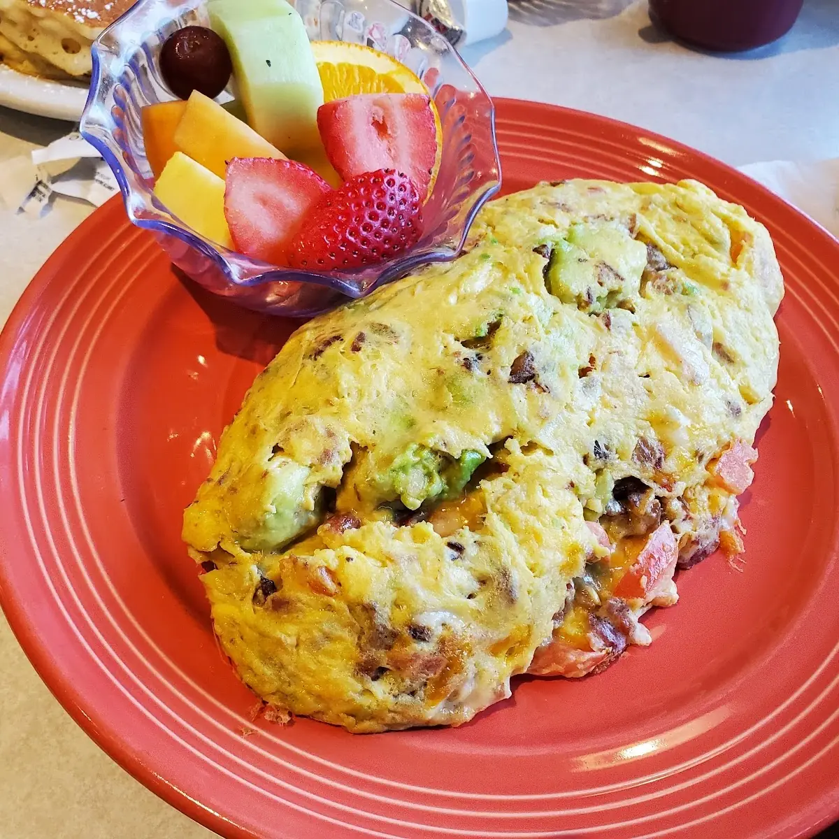 Eggs Benedict with Avocado and Bacon Omelette