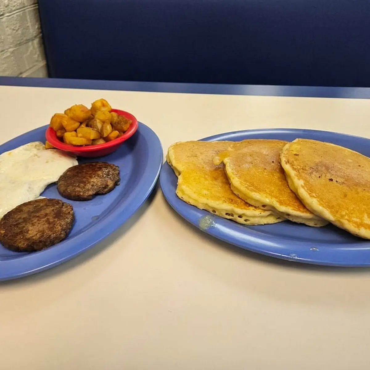 Scrambled Eggs and Sausage Cheese Grits with Tomato