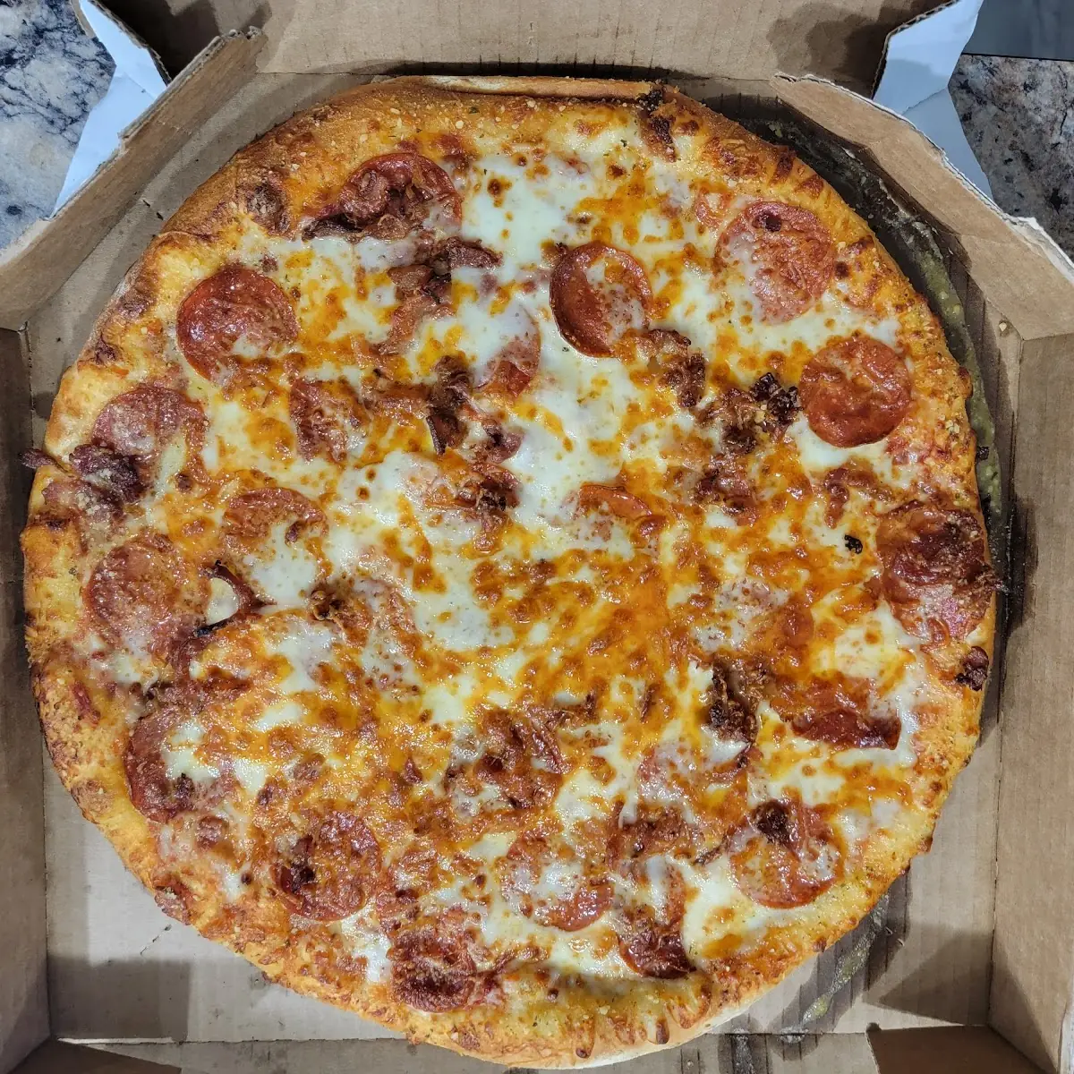 Uncut Pepperoni Bacon and 3 Cheese Pizza