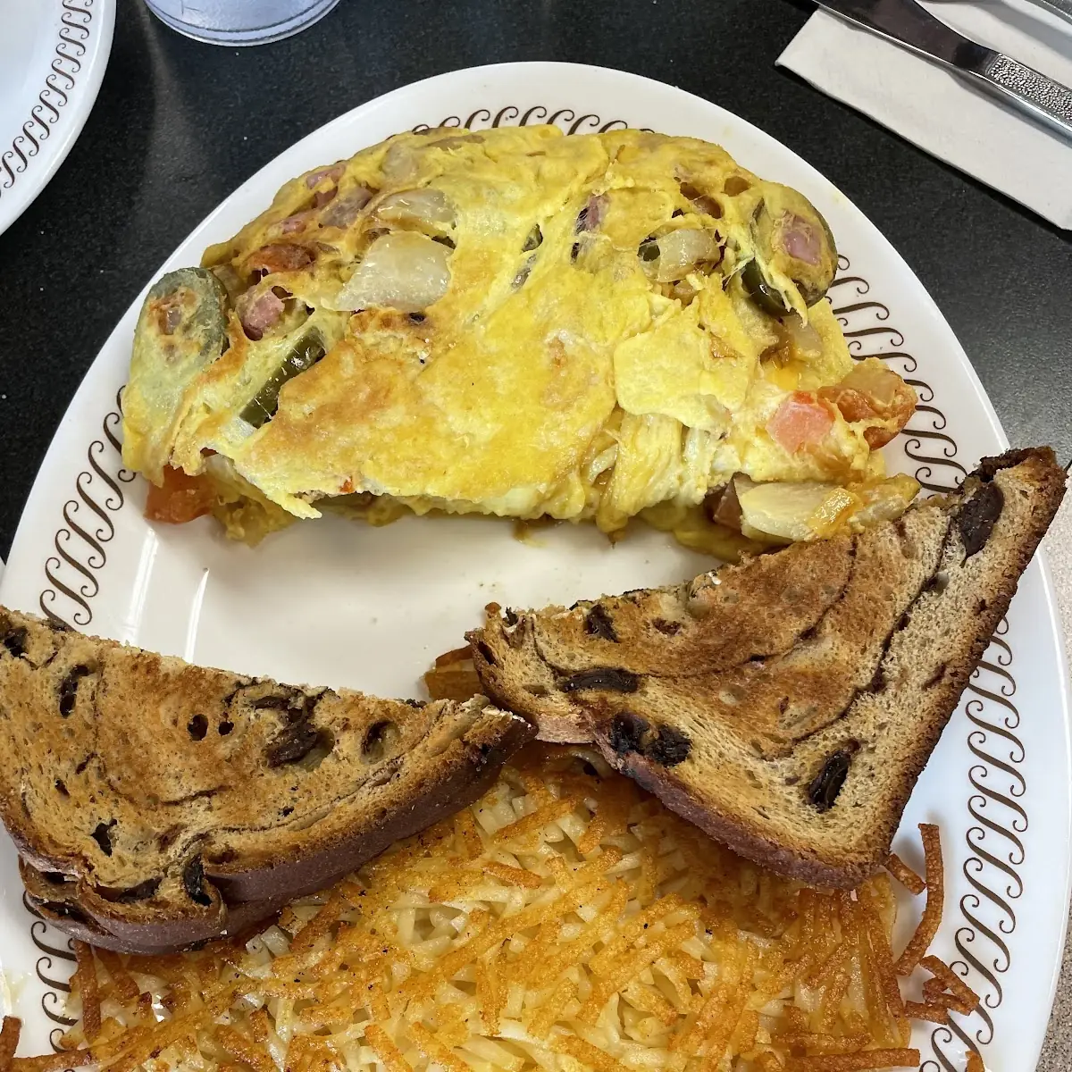 Omelette Raisin Toast and Hashbrowns