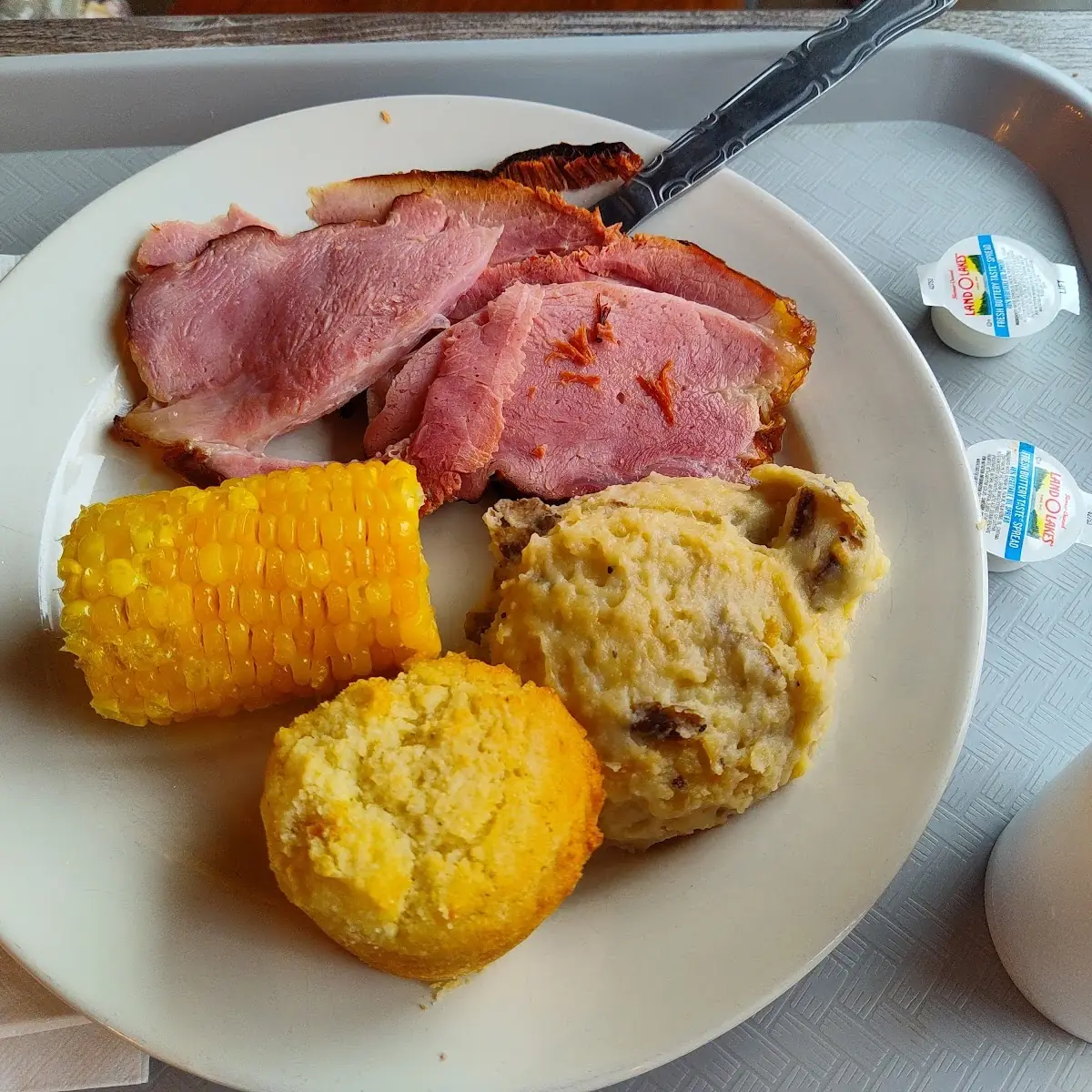 Ham with Loaded Mashed Potatoes Corn and Cornbread