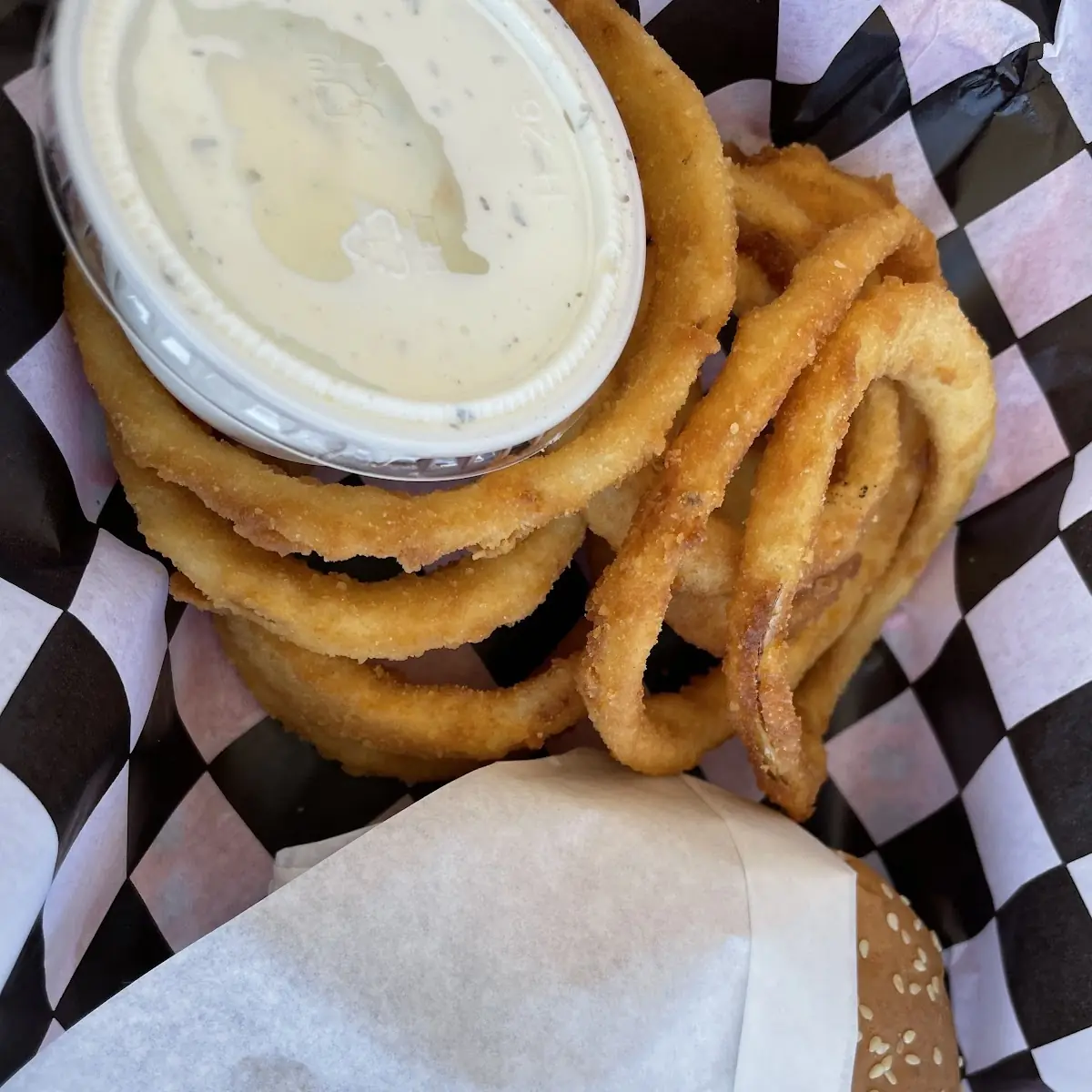 Hamburger with Onion Rings Ranch Dressing and Soda