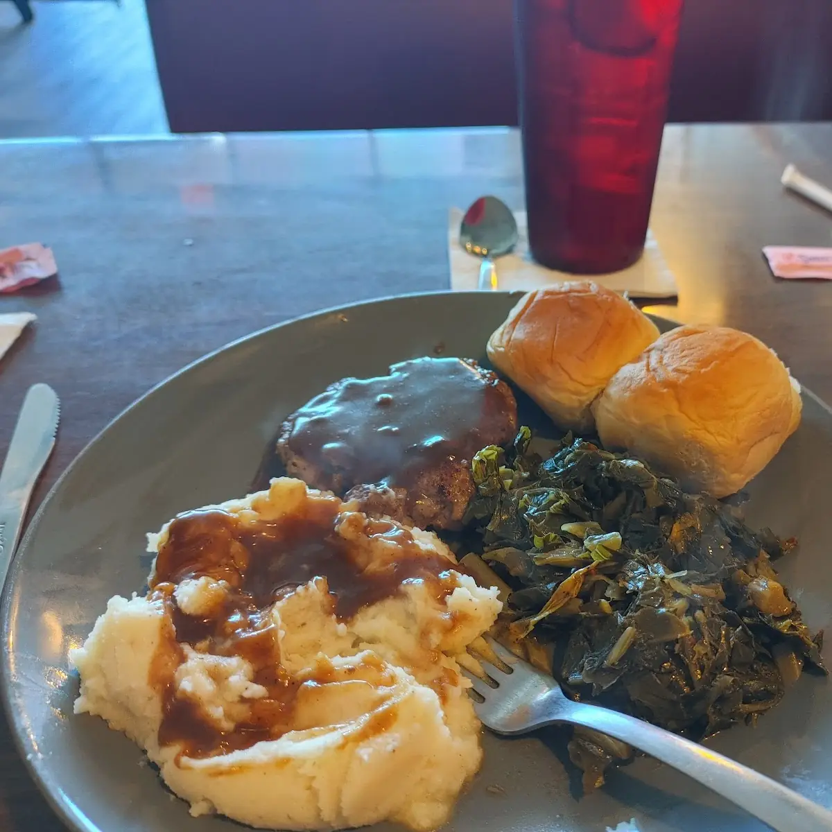 Lunch Special Hamburger Steak Mashed Potatoes Collards Rolls and a Drink