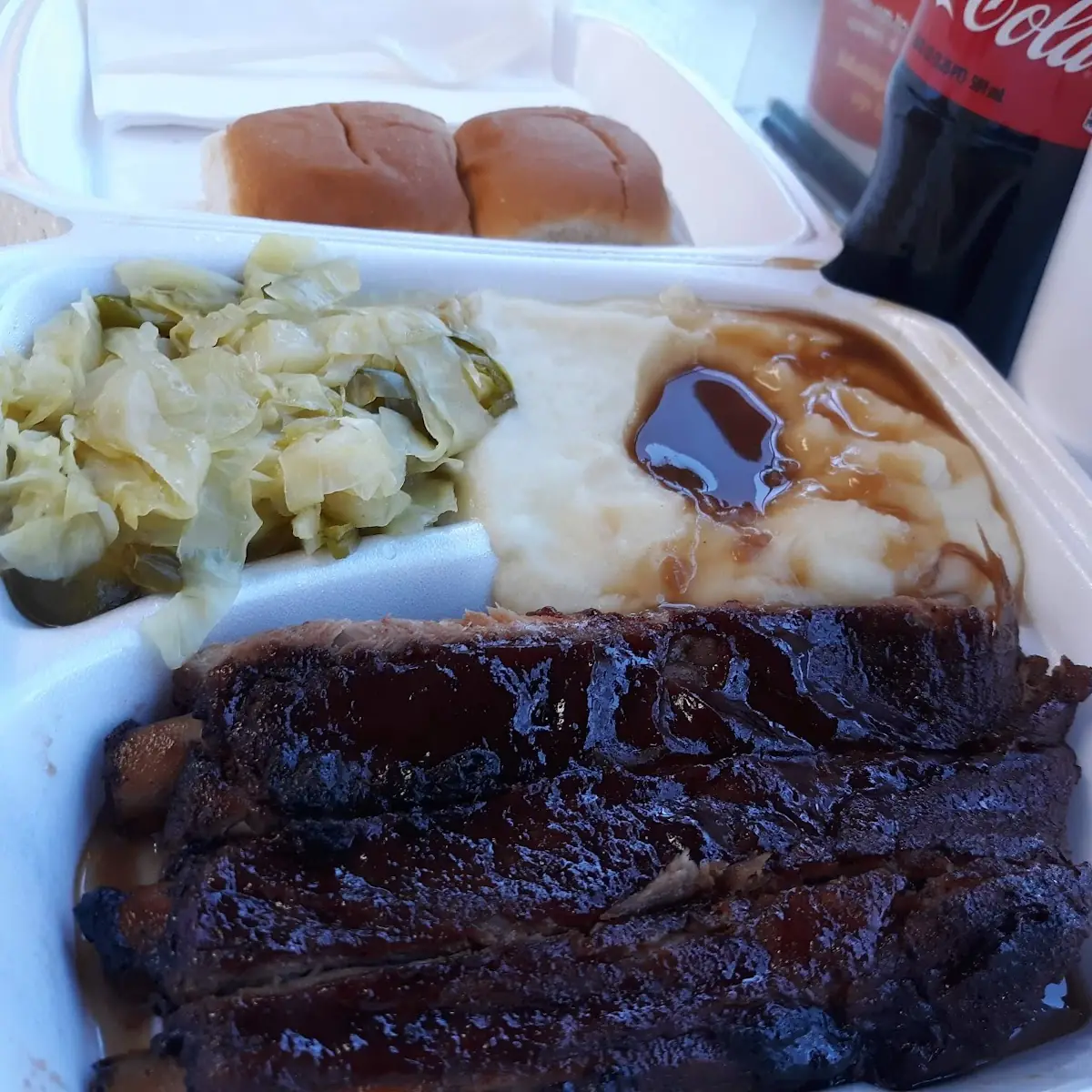 Cabbage with Green Bell Peppers Mashed Potatoes Spareribs and a Coke to Drink
