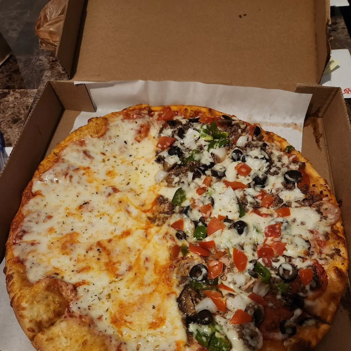A Large Supreme Pizza Half Cheese