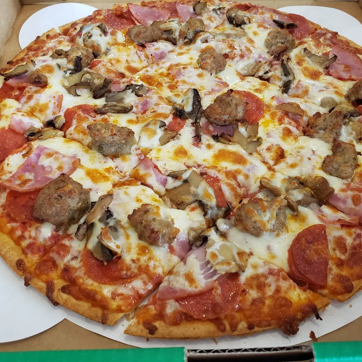 Thin Crust Meat Lover's Pizza with Mushrooms