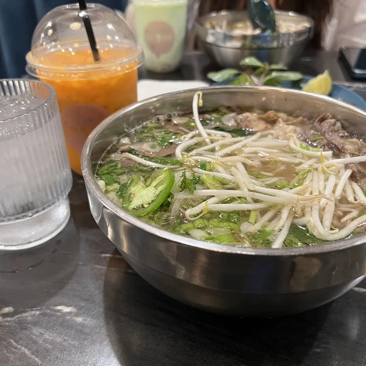 Steaming Beef Pho with Fresh Herbs