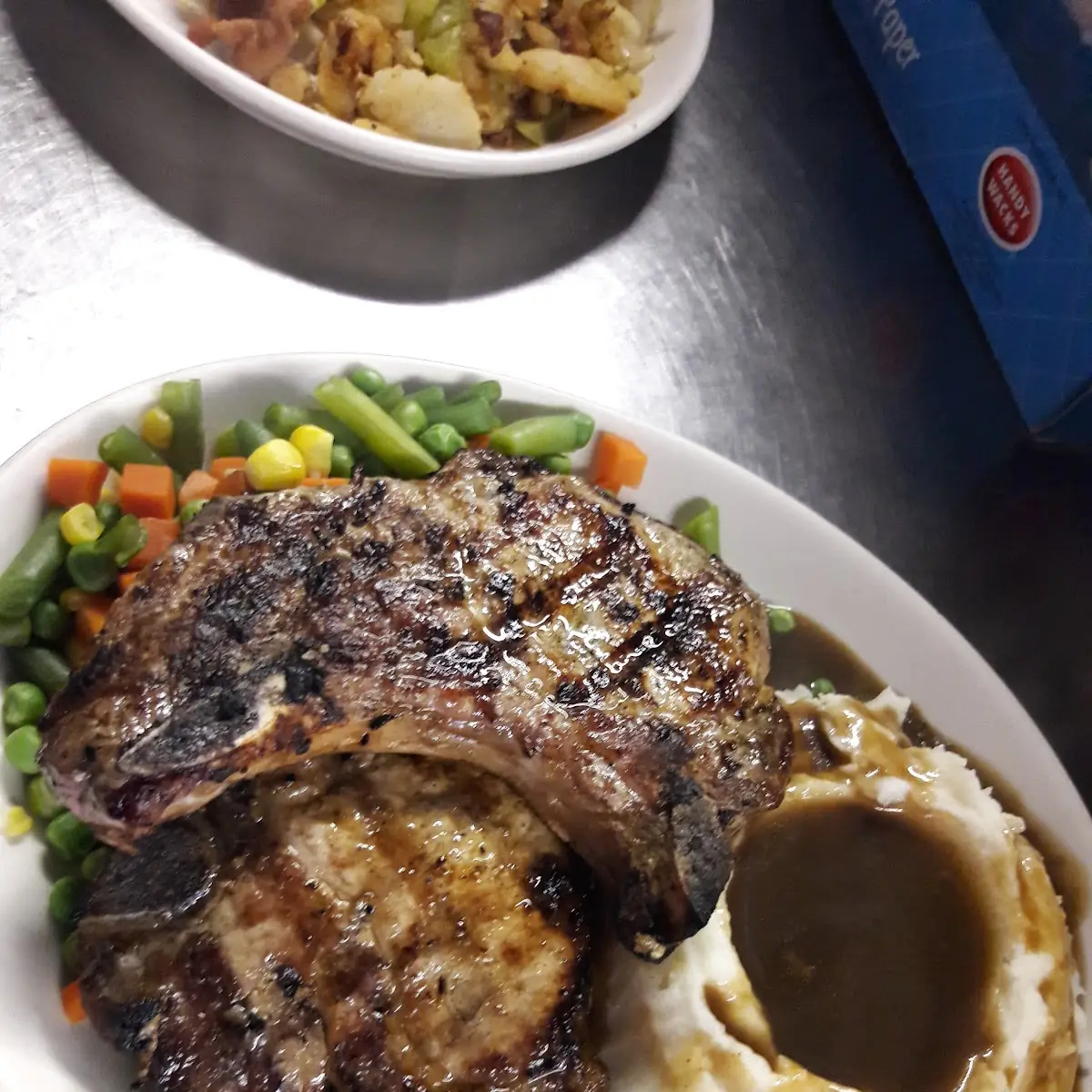 Grilled Pork Chops Mashed Potatoes with Gravy Mix Veggies
