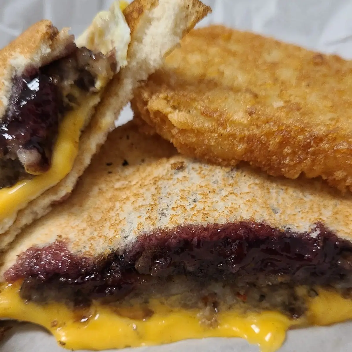 Sausage Eggs Cheese on Toast with Grape Jelly