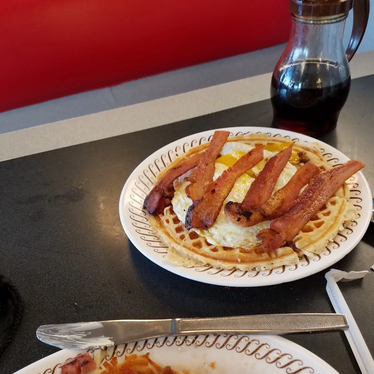 Pecan Waffle over Easy Eggs Bacon Strips