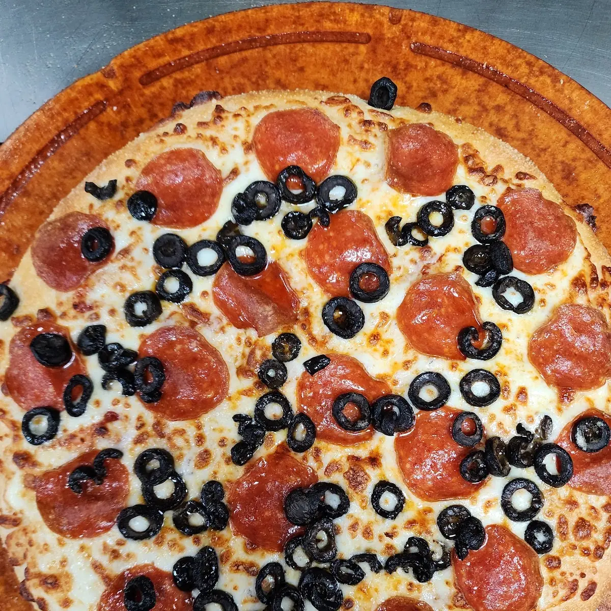 Pepperoni and Black Olives Deep Dish Pizza