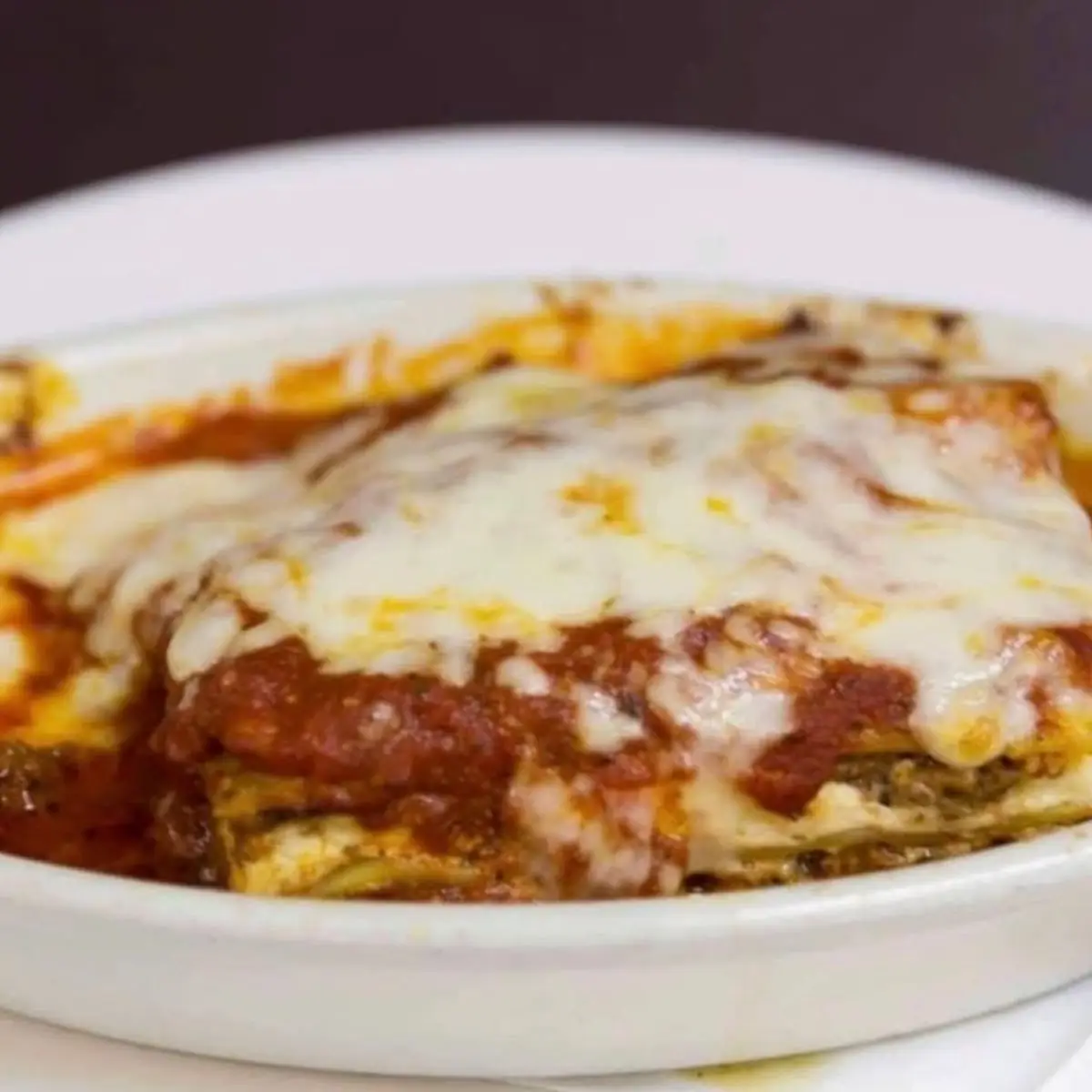 Eggplant Parmigiana with Spaghetti Server with a Dinner Salad Garlic Bread and a Cannoli