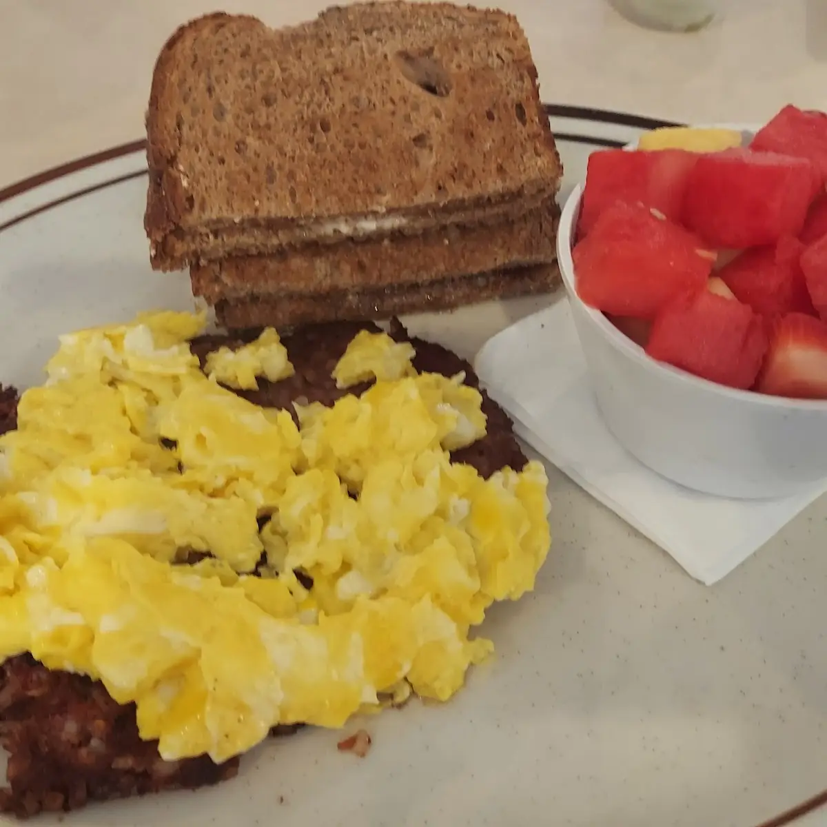 Corned Beef Hash Scrambled Eggs Fruit Whole Wheat Toast