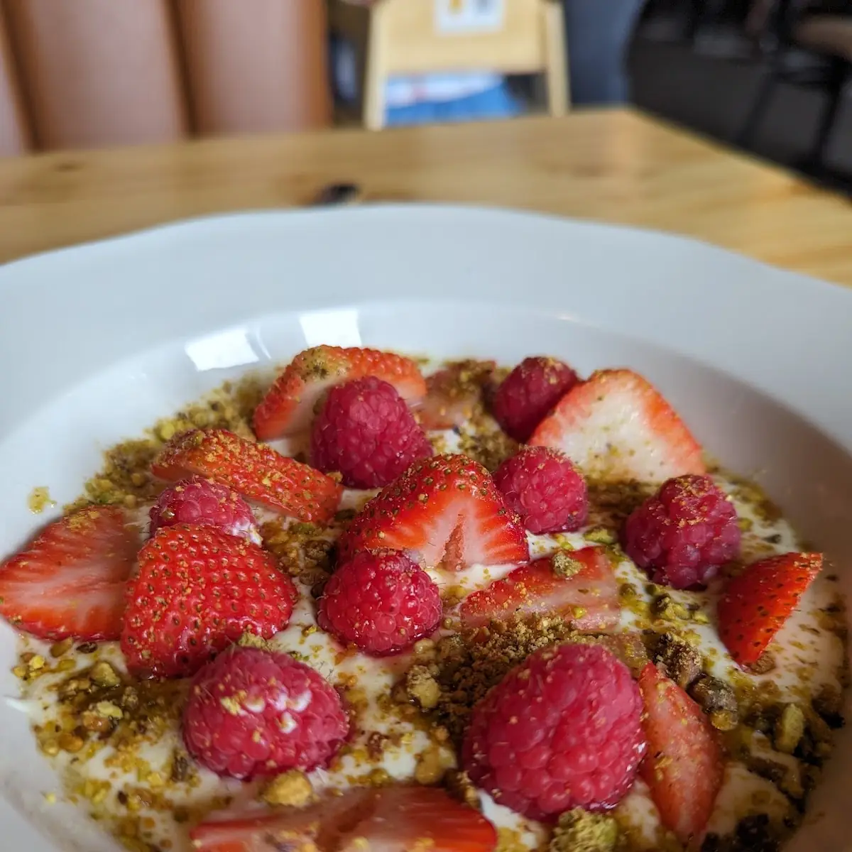 Red Berries with Creme and Pistachio Dust