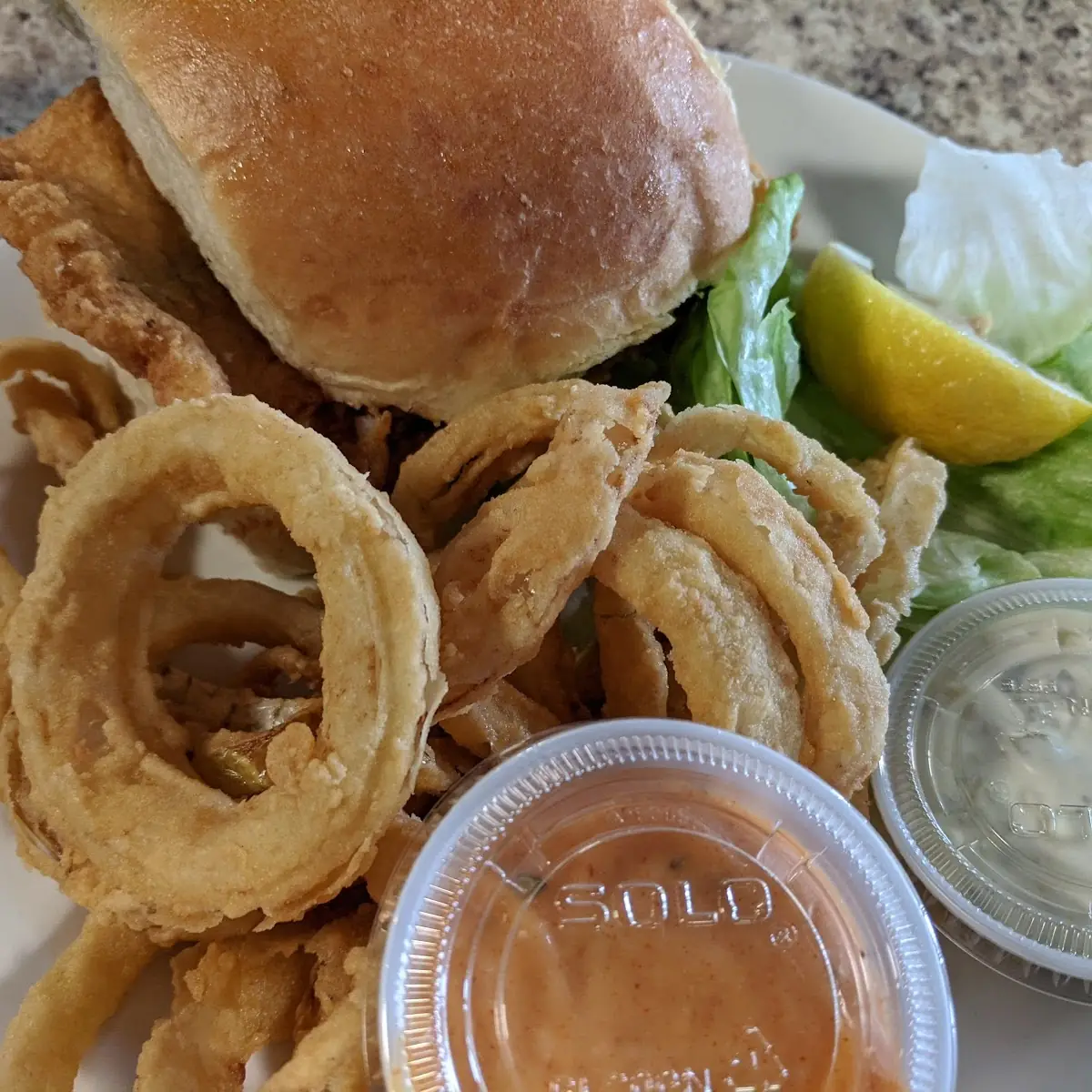 Seafood Sandwich and Onion Rings