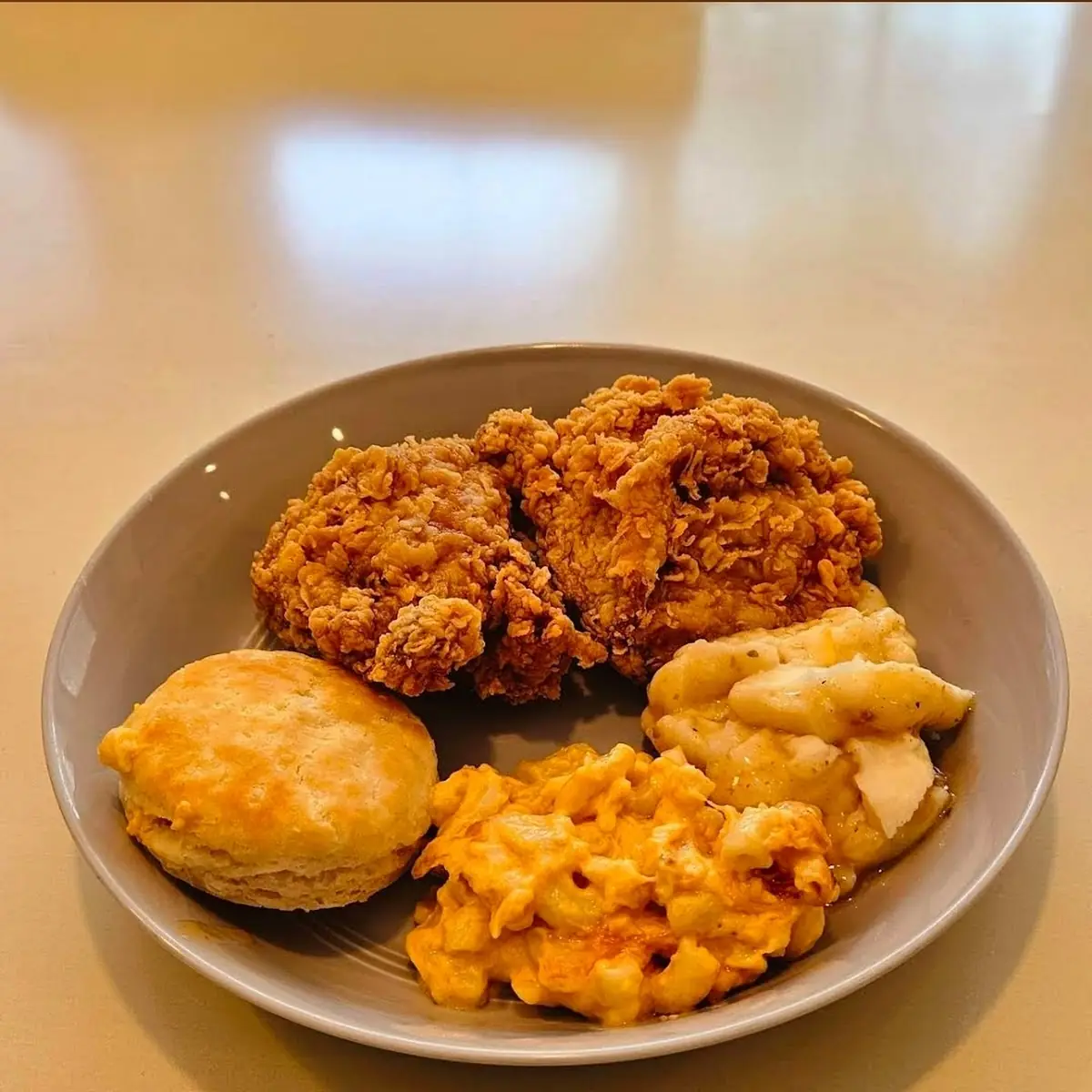 Spicy Fried Chicken with Mashed Potatoes and Gravy Mac-N-Cheese and a Biscuit