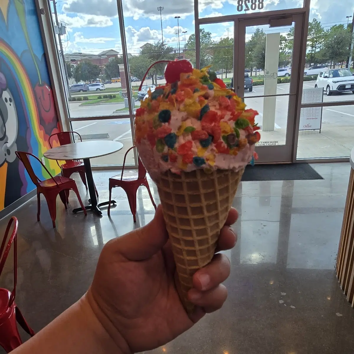 Fruitty Cereal Milk Ice Cream with Fruitty Pebble Topping and Cherry