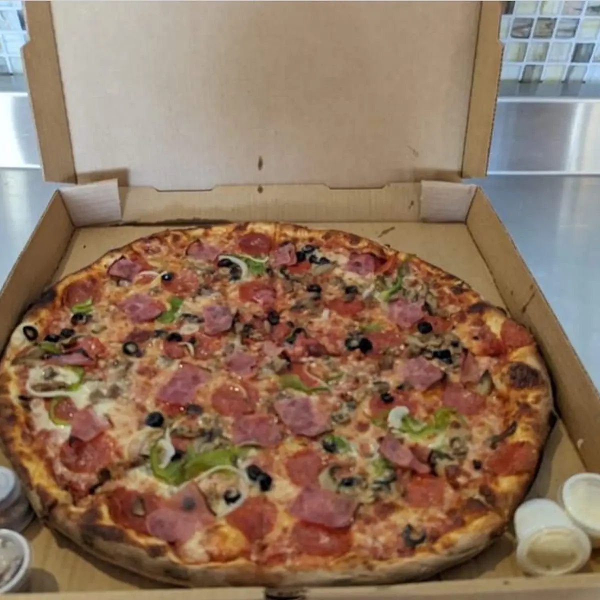 Round Pizza with Various Meat Toppings