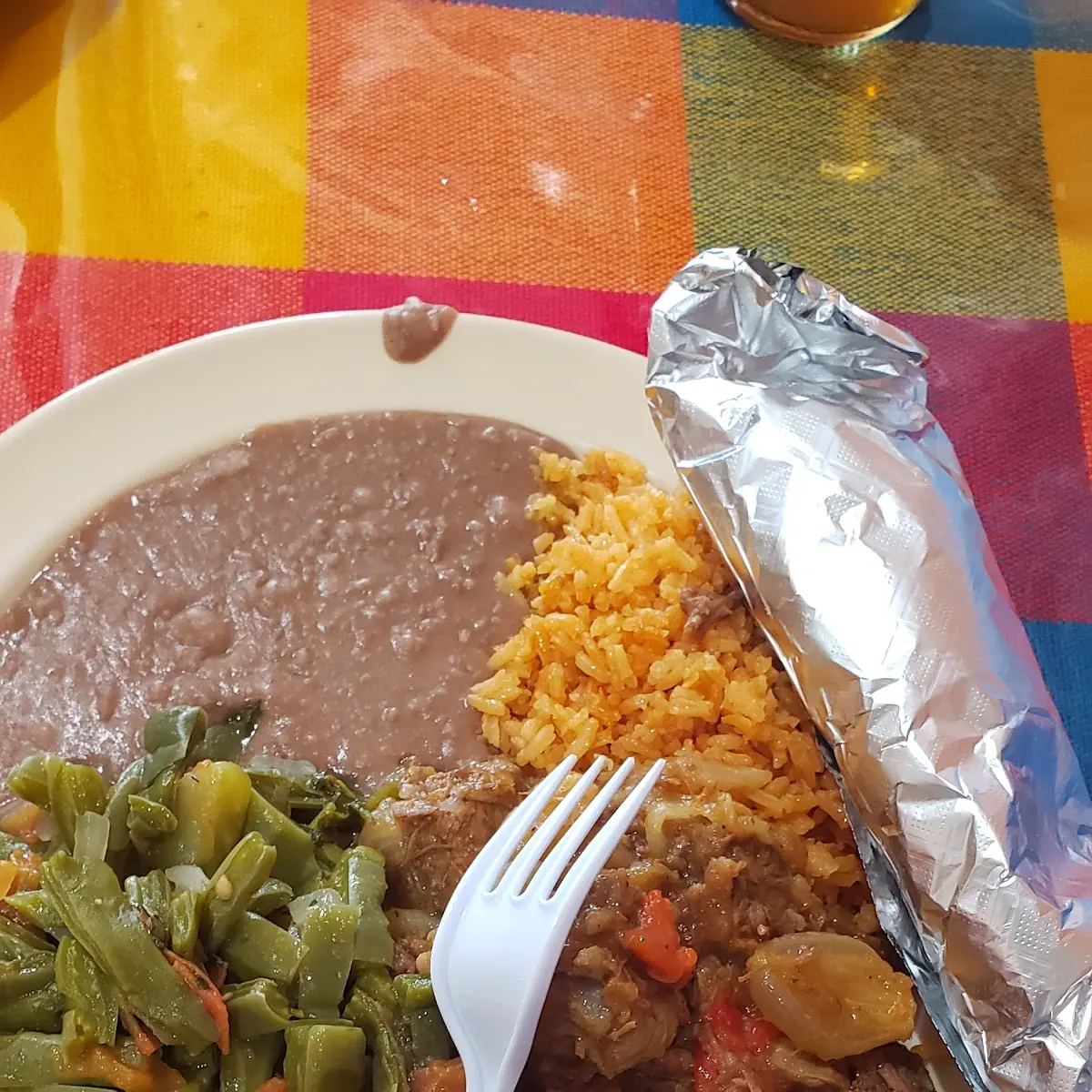 Noplas Carne Guisada Refried Beans Rice