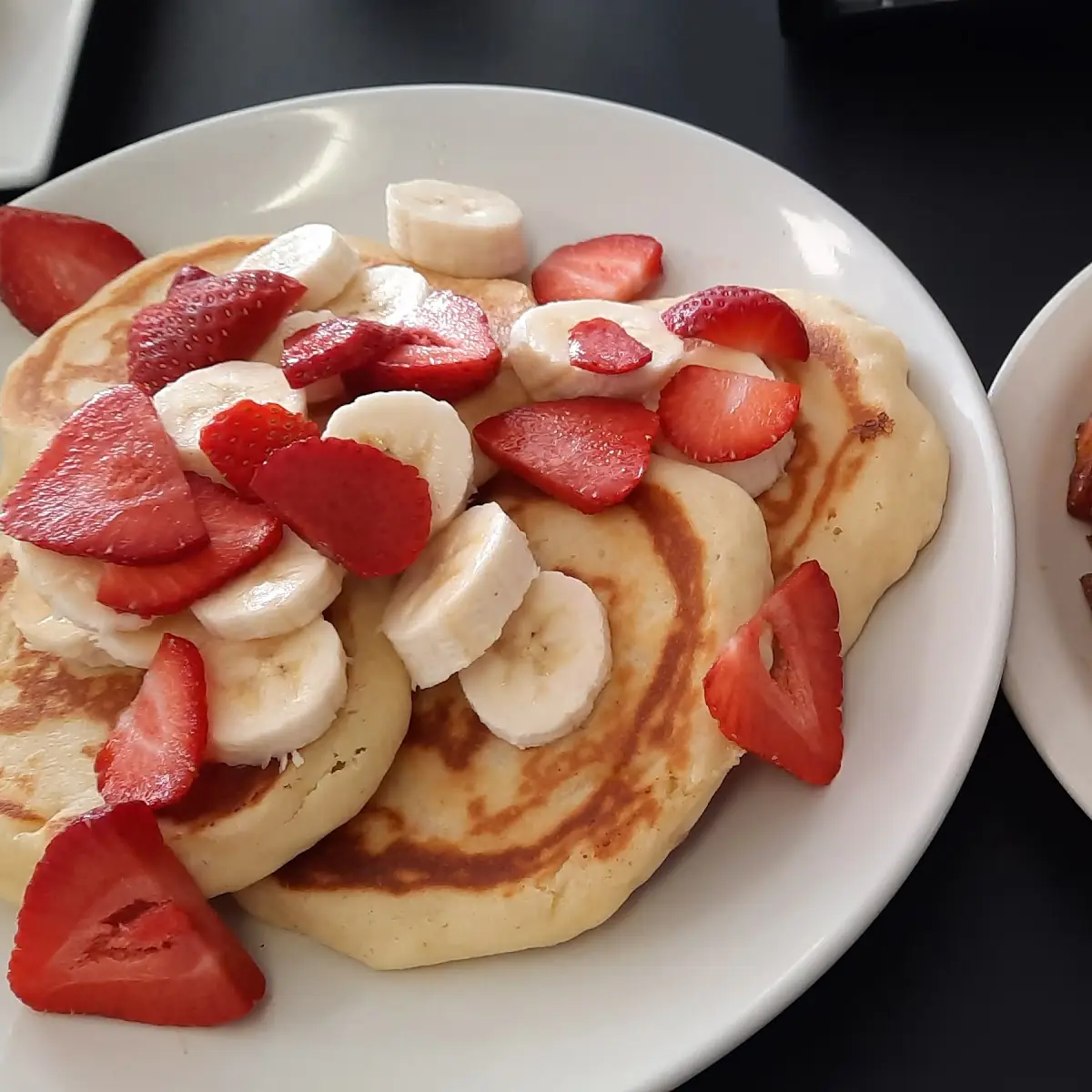 Double Stack Pancakes Potatoes and Fried Egg