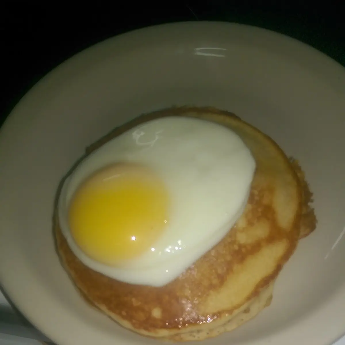 Pancakes with over Easy Eggs