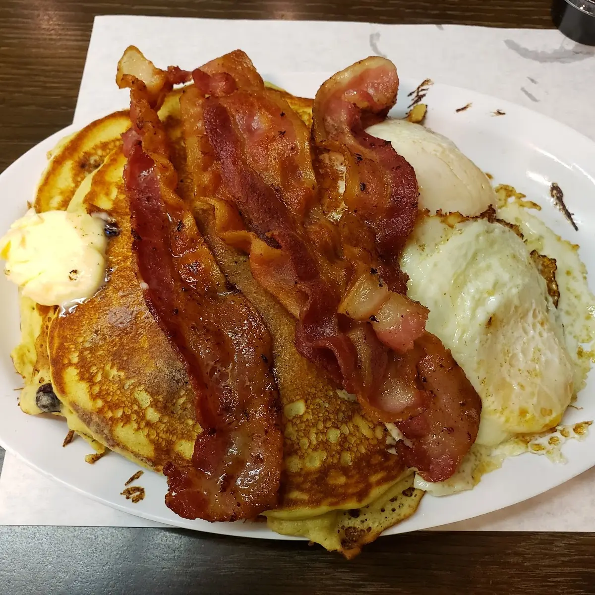 Blueberry Pancakes Bacon and 2 Eggs over Medium